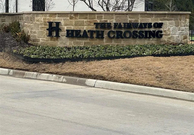 a front view of a building with a garden