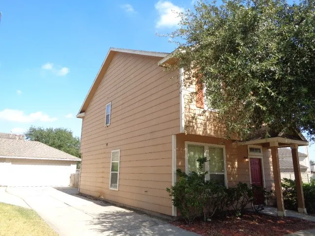 a front view of a house with garage