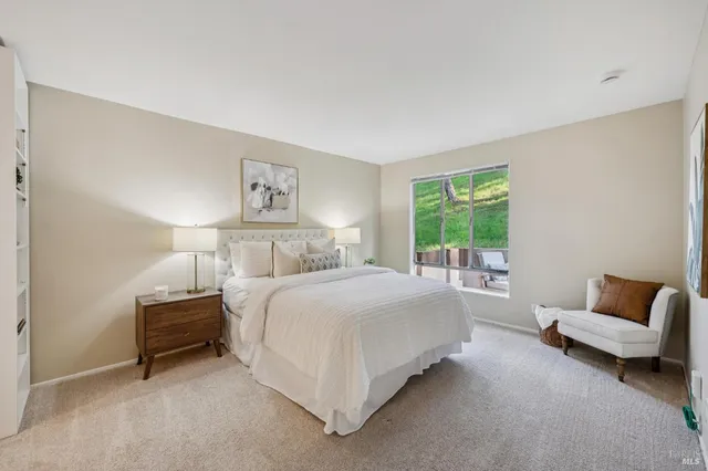 a bedroom with a bed and a couch