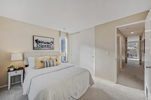 a bedroom with a bed and a view of bathroom