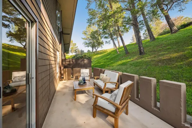 a balcony with view of an outdoor space