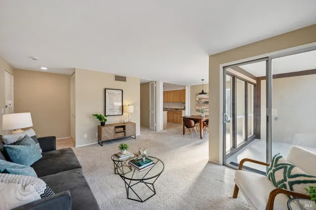 a living room with furniture and a table