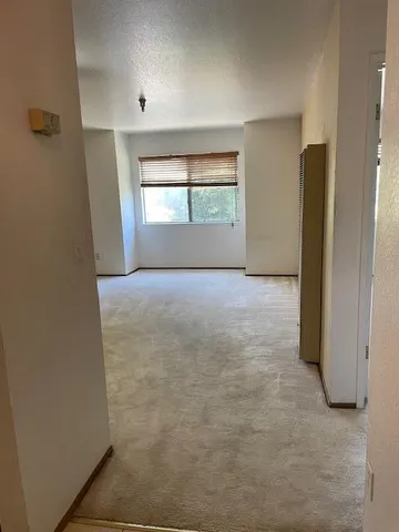 a view of an empty room and window