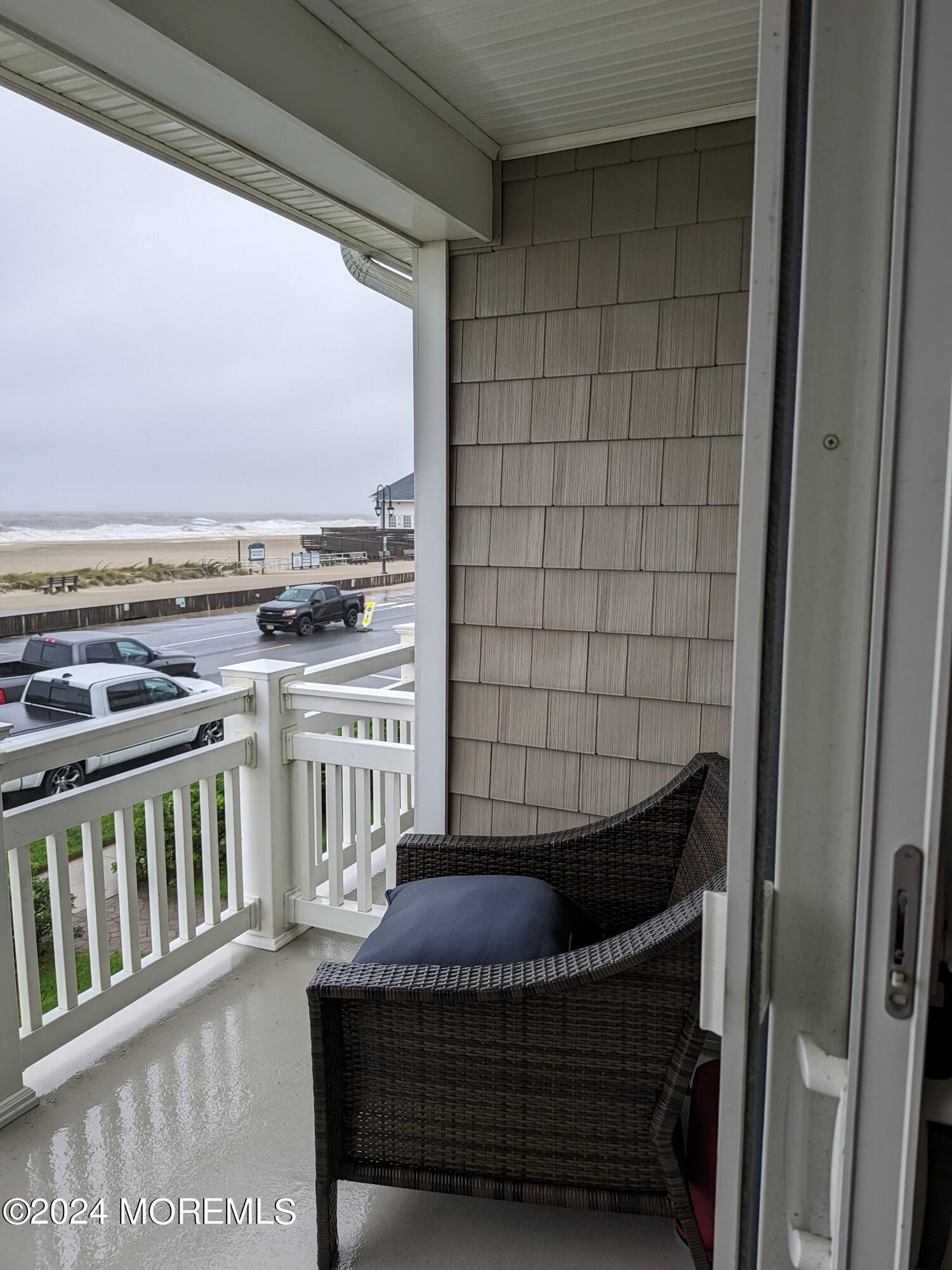 407 Ocean Avenue, Unit 14A WINTER RENTAL Belmar, NJ 07719 - Photo 3 of 8 a view of a balcony with furniture