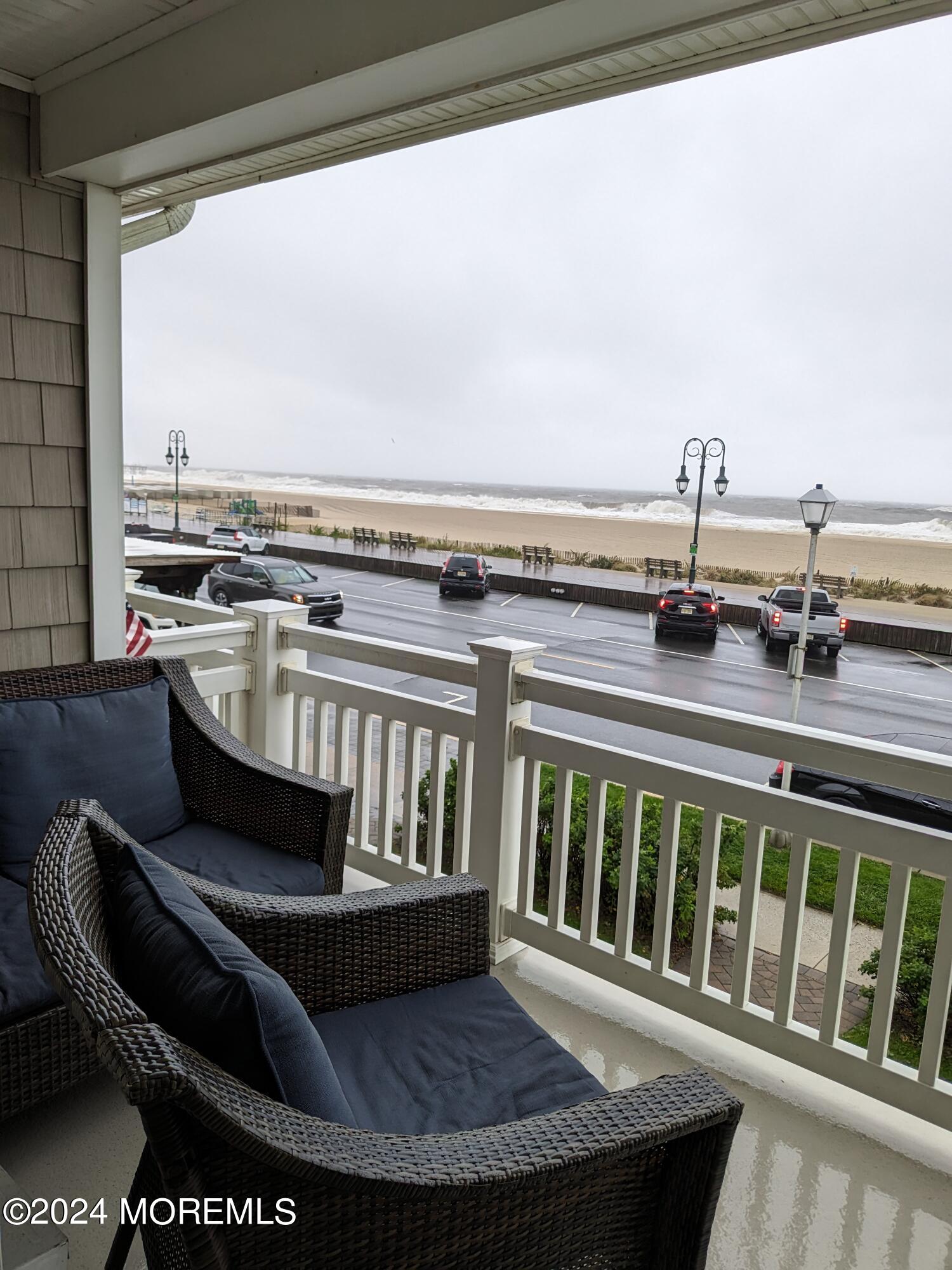 407 Ocean Avenue, Unit 14A WINTER RENTAL Belmar, NJ 07719 - Photo 4 of 8 a view of a chairs and table in the balcony