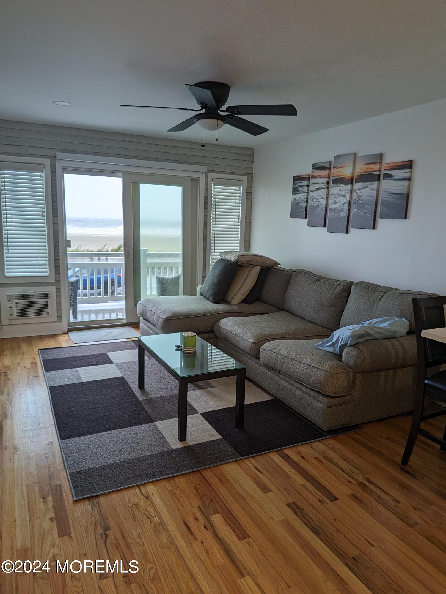 407 Ocean Avenue, Unit 14A WINTER RENTAL Belmar, NJ 07719 - Photo 6 of 8 a living room with furniture and a large window