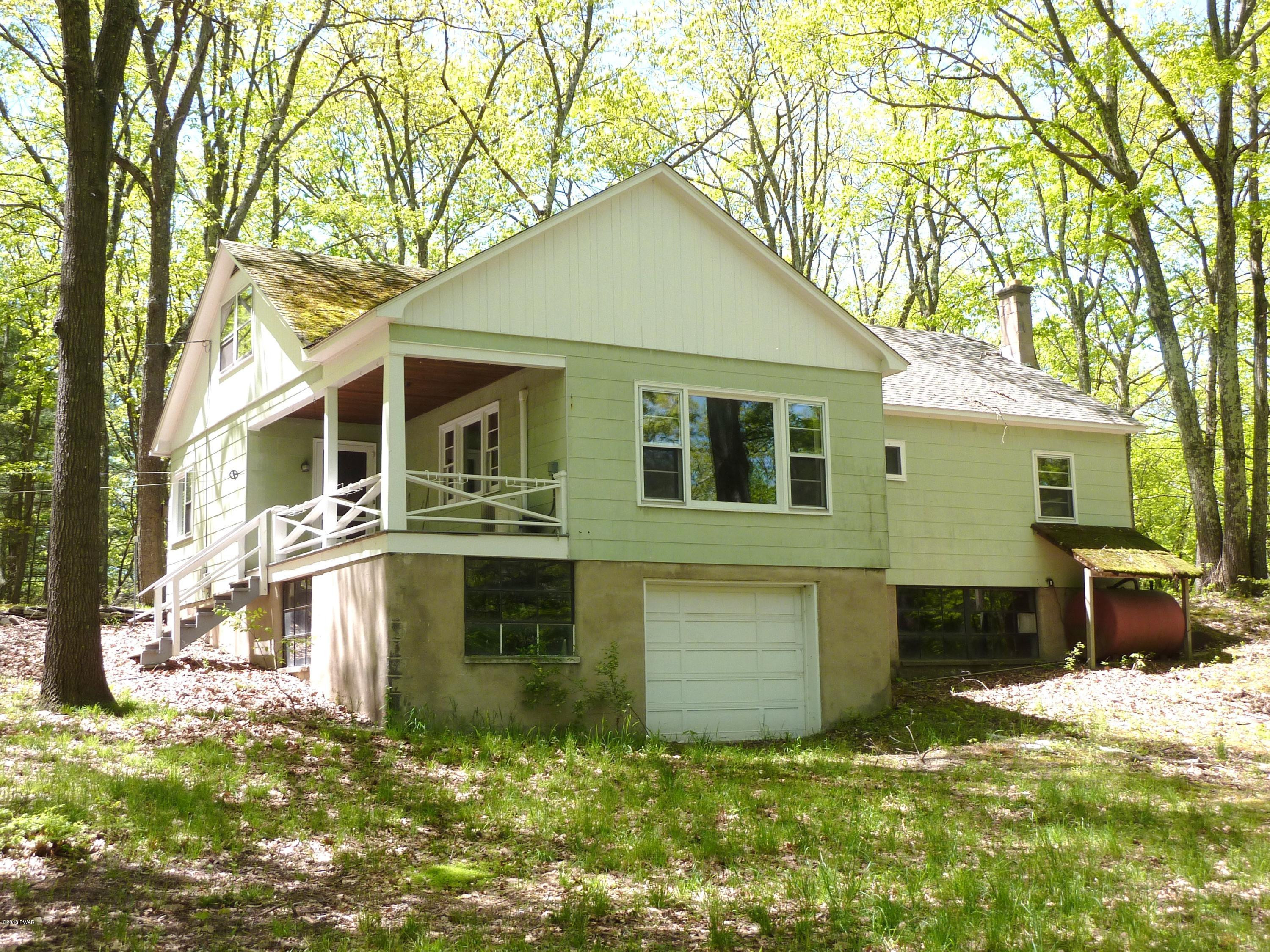 27 E Road Hawley, PA 18428 - Photo 2 of 22 a front view of a house with a yard