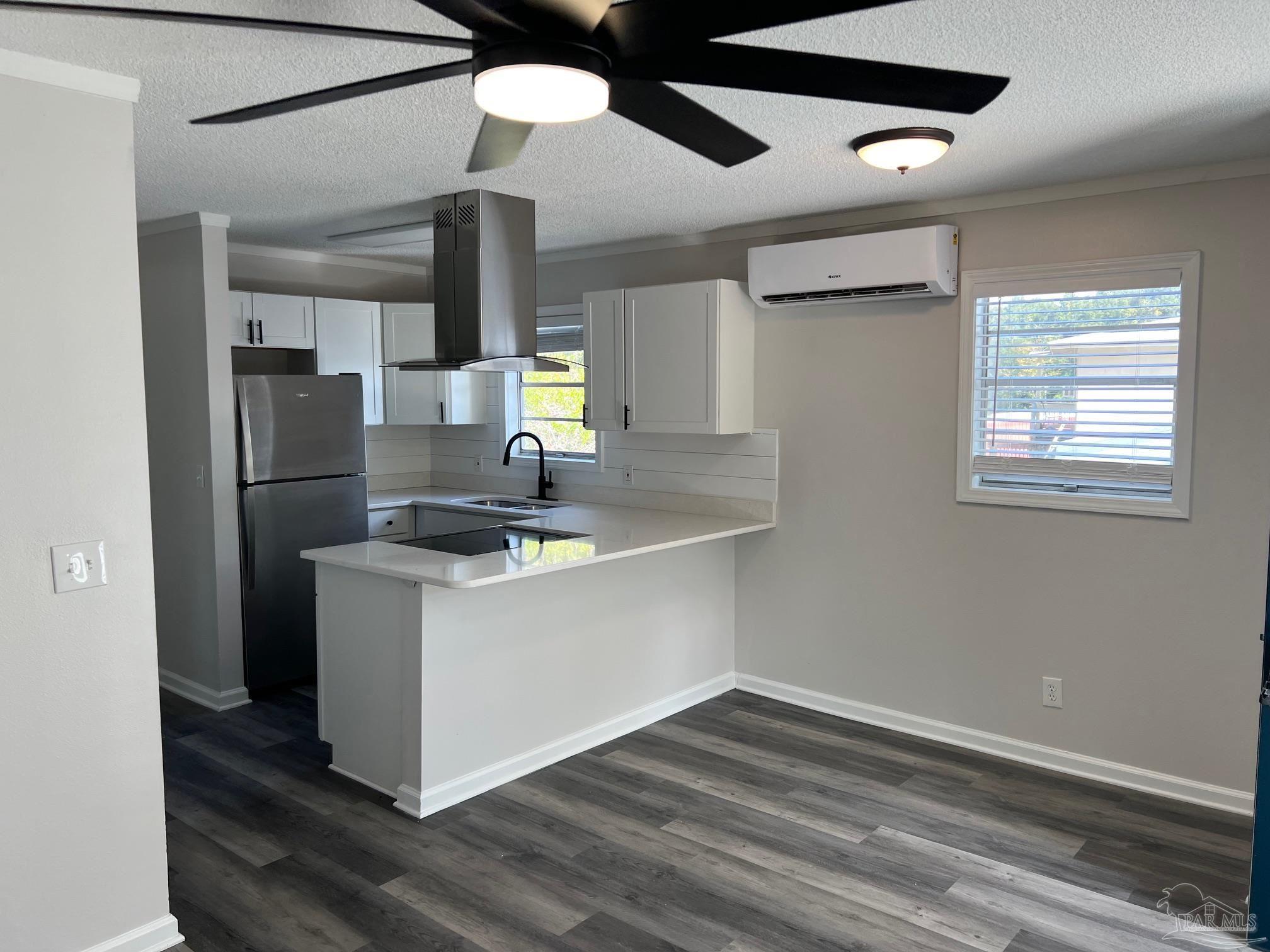 6644 Applegate Street Milton, FL 32570 - Photo 2 of 8 a kitchen with stainless steel appliances granite countertop a sink a stove and a refrigerator