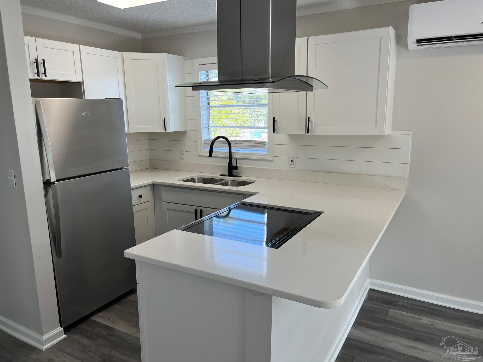 6644 Applegate Street Milton, FL 32570 - Photo 3 of 8 a kitchen with a refrigerator sink and cabinets
