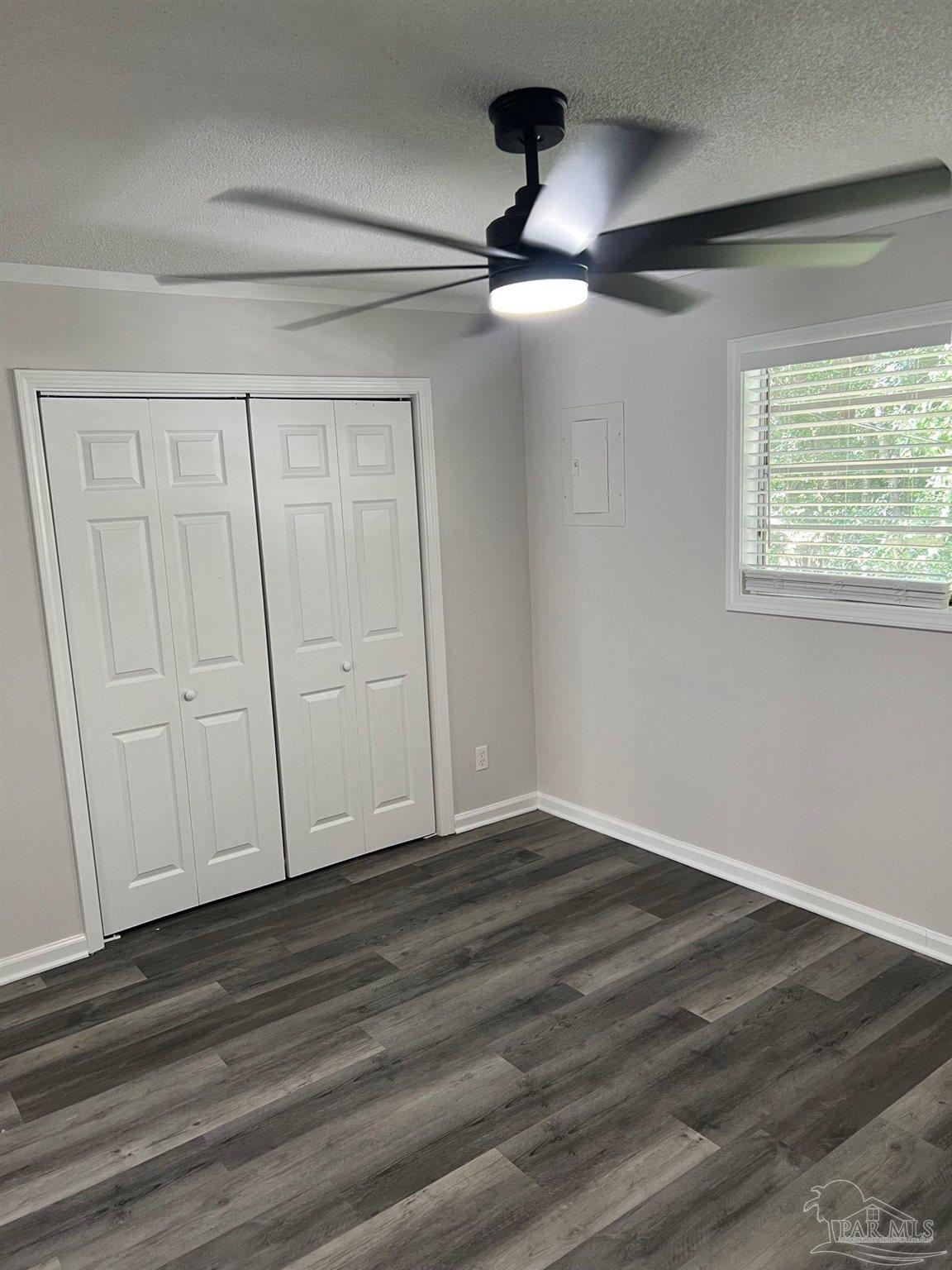 6644 Applegate Street Milton, FL 32570 - Photo 7 of 8 a view of an empty room with wooden floor