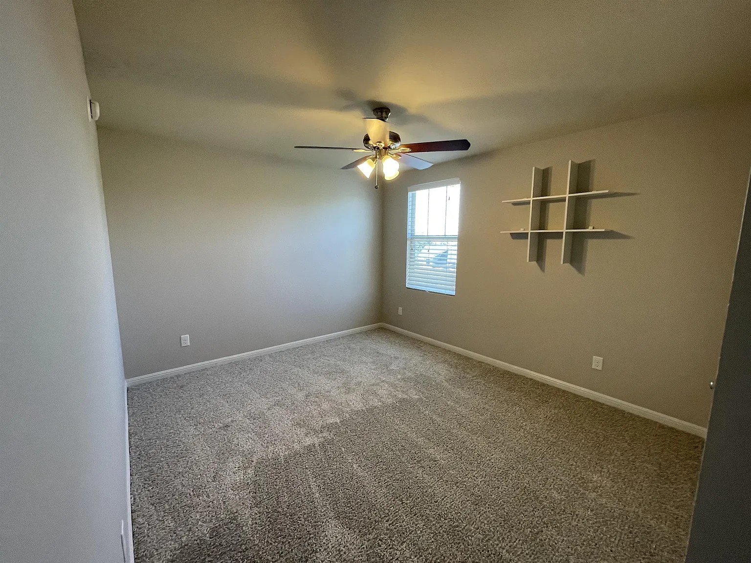 5136 Hellman Kyle, TX 78640 - Photo 14 of 17 Carpeted spare room with baseboards and a ceiling fan