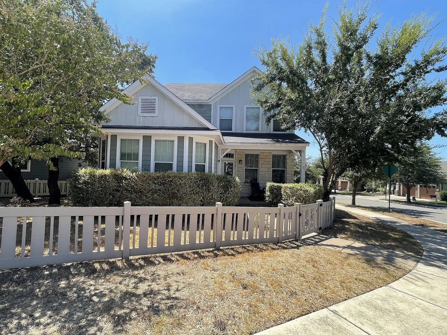 5136 Hellman Kyle, TX 78640 - Photo 8 of 17 View of front of house with covered porch and a fenced front yard