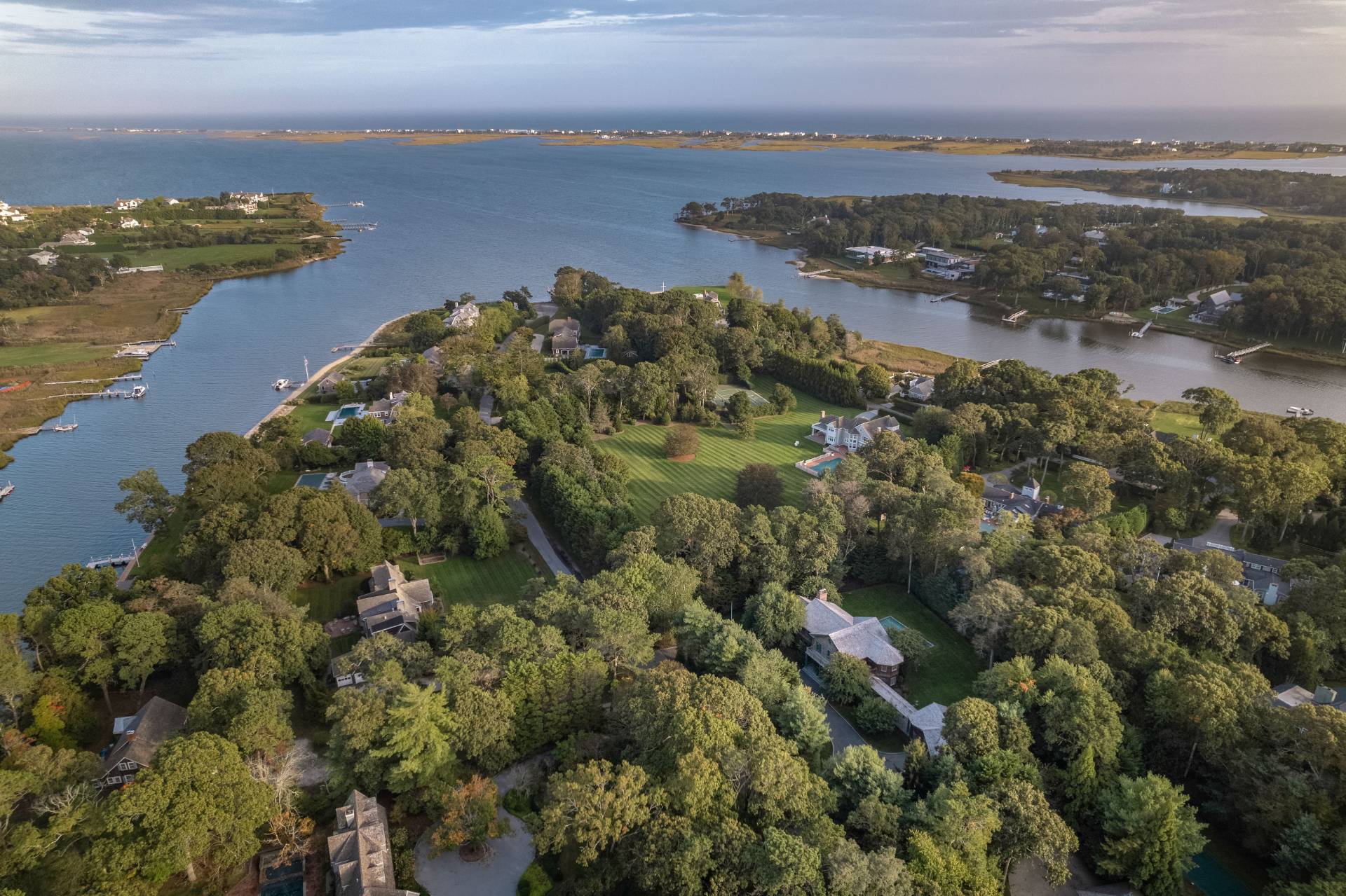 12 Old Point Road Quogue, NY 11959 - Photo 3 of 50 a view of a lake with a city