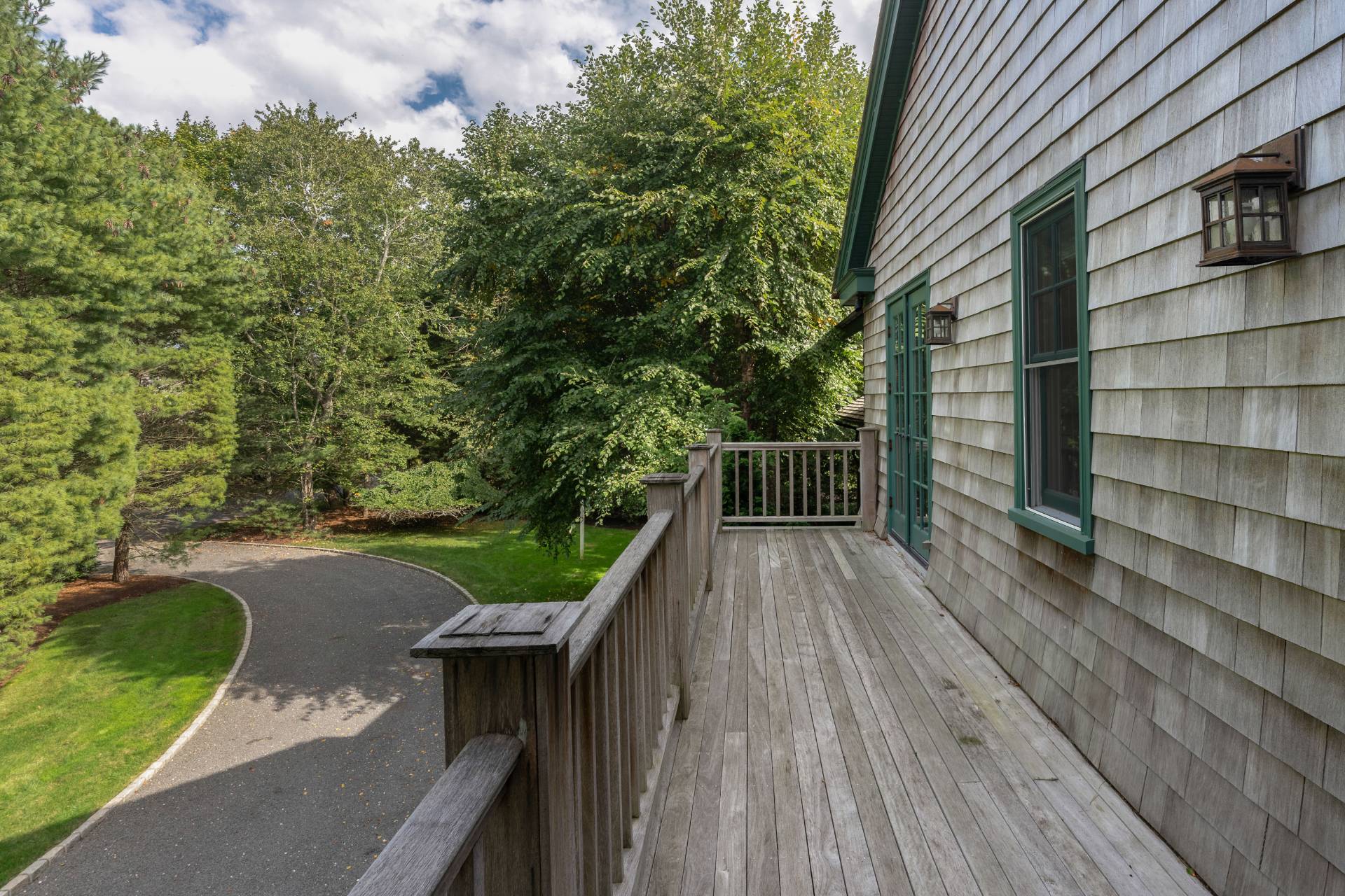 12 Old Point Road Quogue, NY 11959 - Photo 33 of 50 a view of a balcony with wooden floor and fence