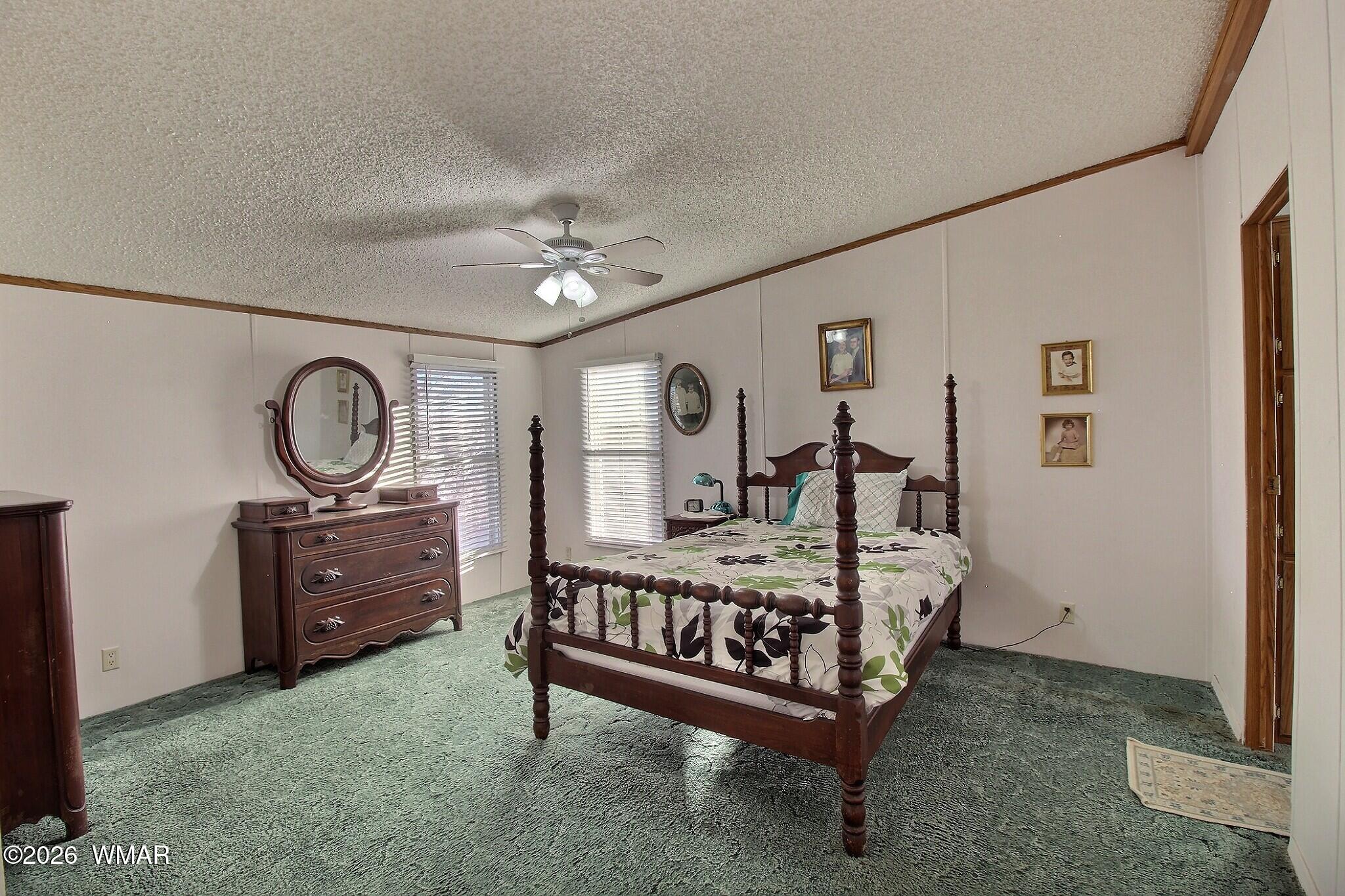 4710 Hay Hollow Road Snowflake, AZ 85937 - Photo 6 of 20 a bed room with furniture and a chandelier