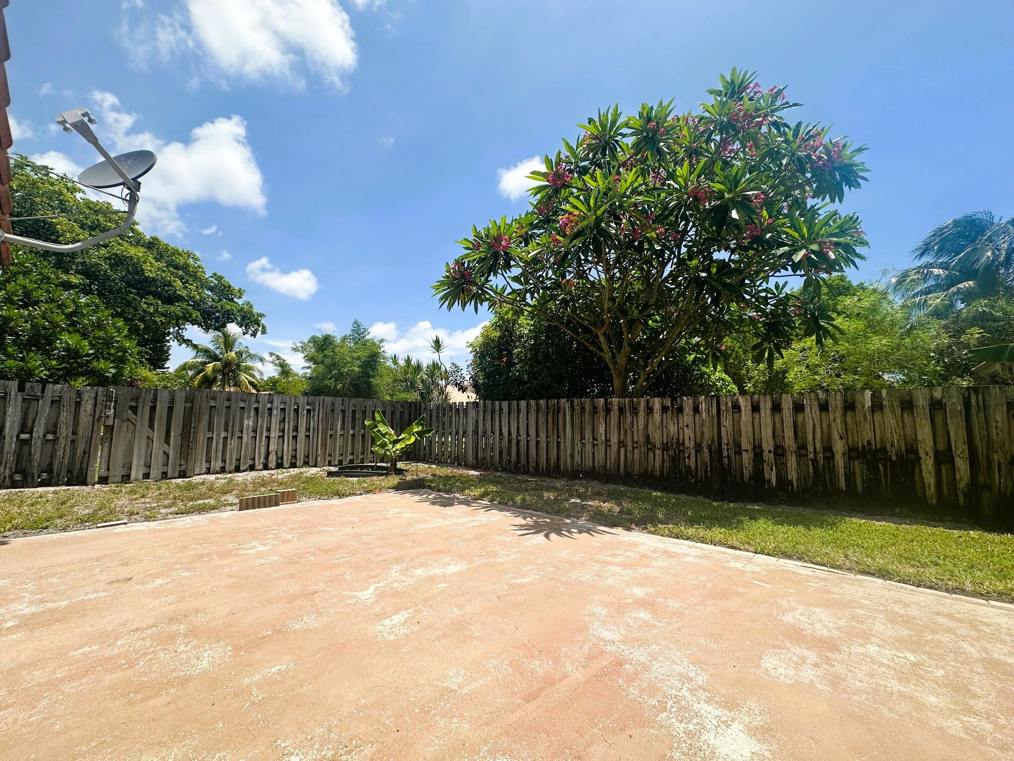 2195 Northwest 14th Street Delray Beach, FL 33445 - Photo 30 of 44 a view of backyard with wooden fence