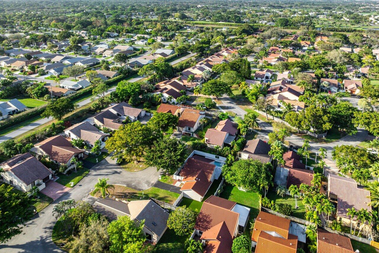 2195 Northwest 14th Street Delray Beach, FL 33445 - Photo 35 of 44 an aerial view of residential houses with outdoor space and trees