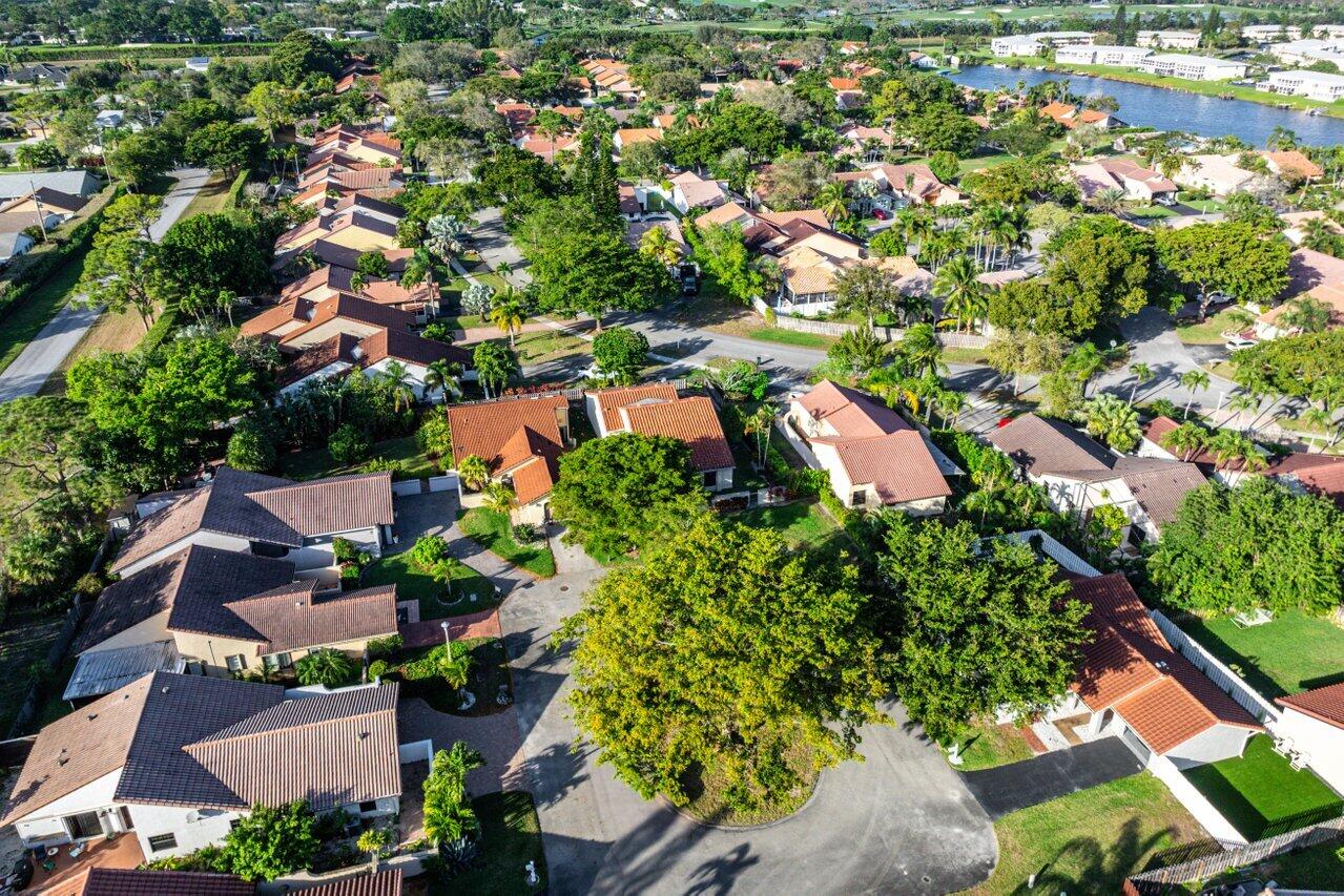 2195 Northwest 14th Street Delray Beach, FL 33445 - Photo 36 of 44 an aerial view of residential houses with outdoor space and trees all around