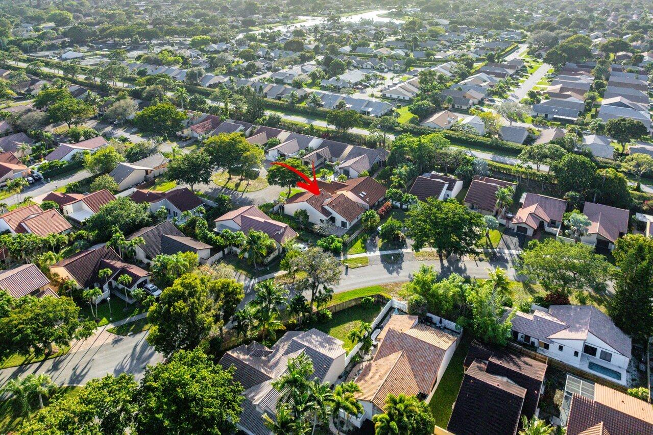 2195 Northwest 14th Street Delray Beach, FL 33445 - Photo 42 of 44 an aerial view of residential houses with street and green space