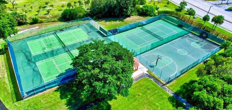 2195 Northwest 14th Street Delray Beach, FL 33445 - Photo 44 of 44 an aerial view of a tennis ground with a swimming pool