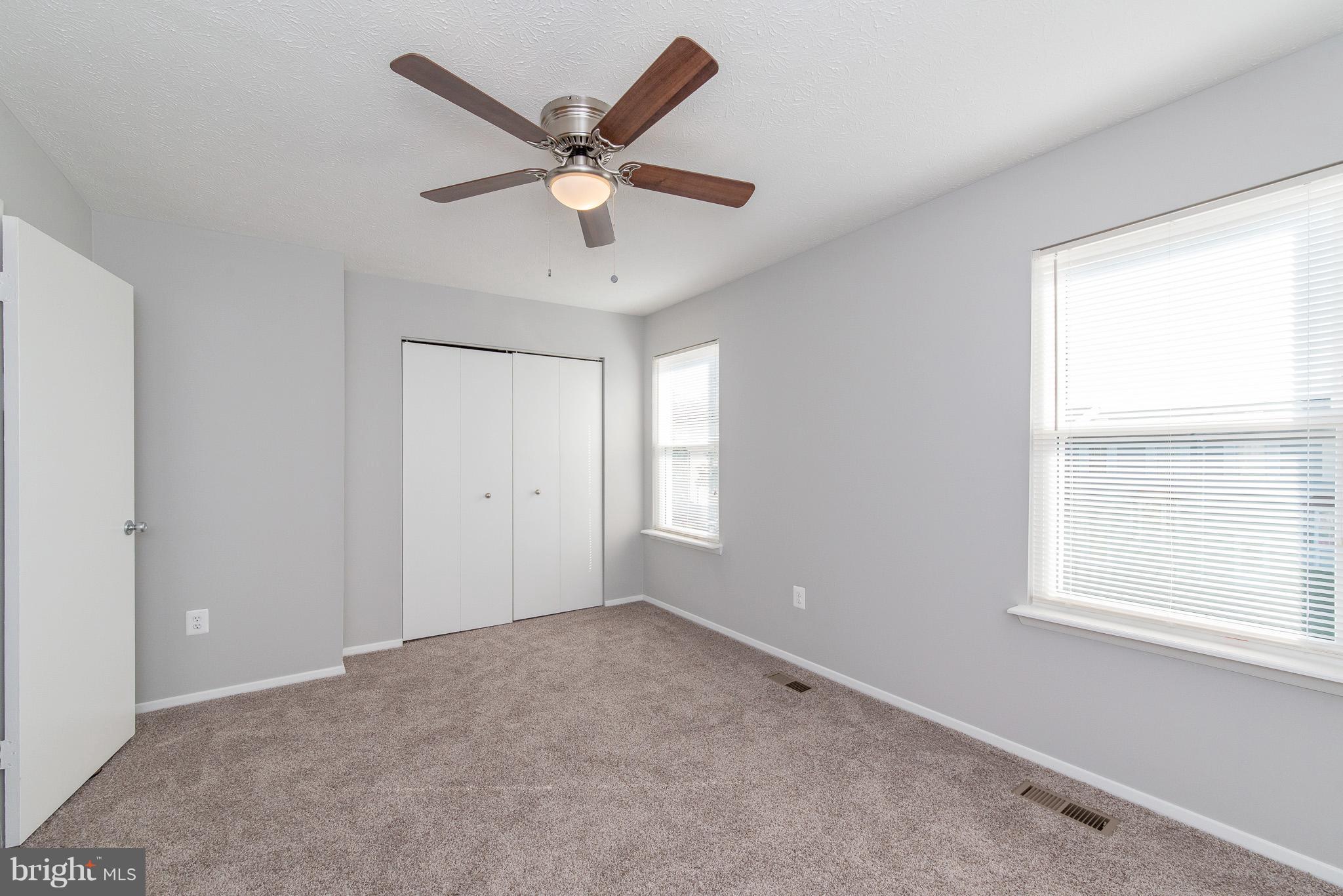 426 Kosoak Road Baltimore, MD 21220 - Photo 12 of 30 an empty room with a window and a fan