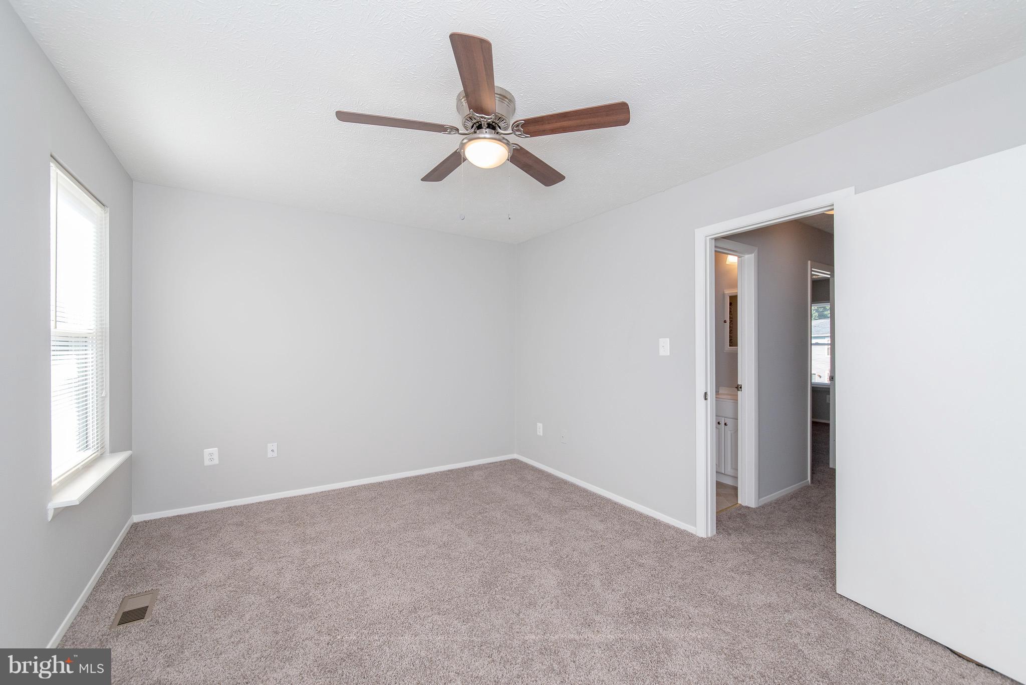 426 Kosoak Road Baltimore, MD 21220 - Photo 13 of 30 a view of a livingroom with a ceiling fan and window