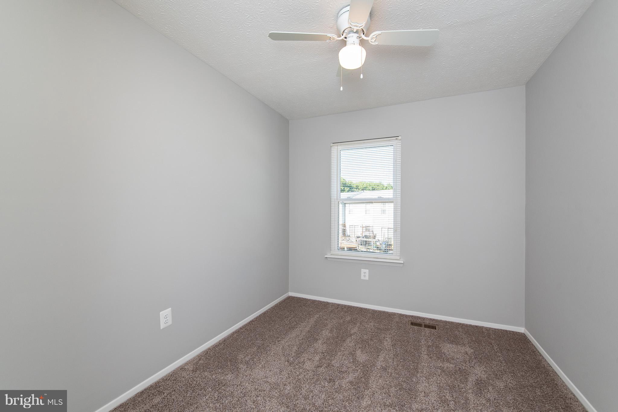 426 Kosoak Road Baltimore, MD 21220 - Photo 16 of 30 an empty room with a window and a fan