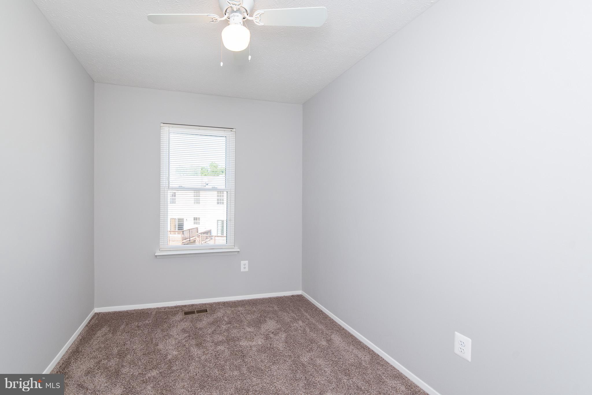 426 Kosoak Road Baltimore, MD 21220 - Photo 18 of 30 an empty room with windows and fan
