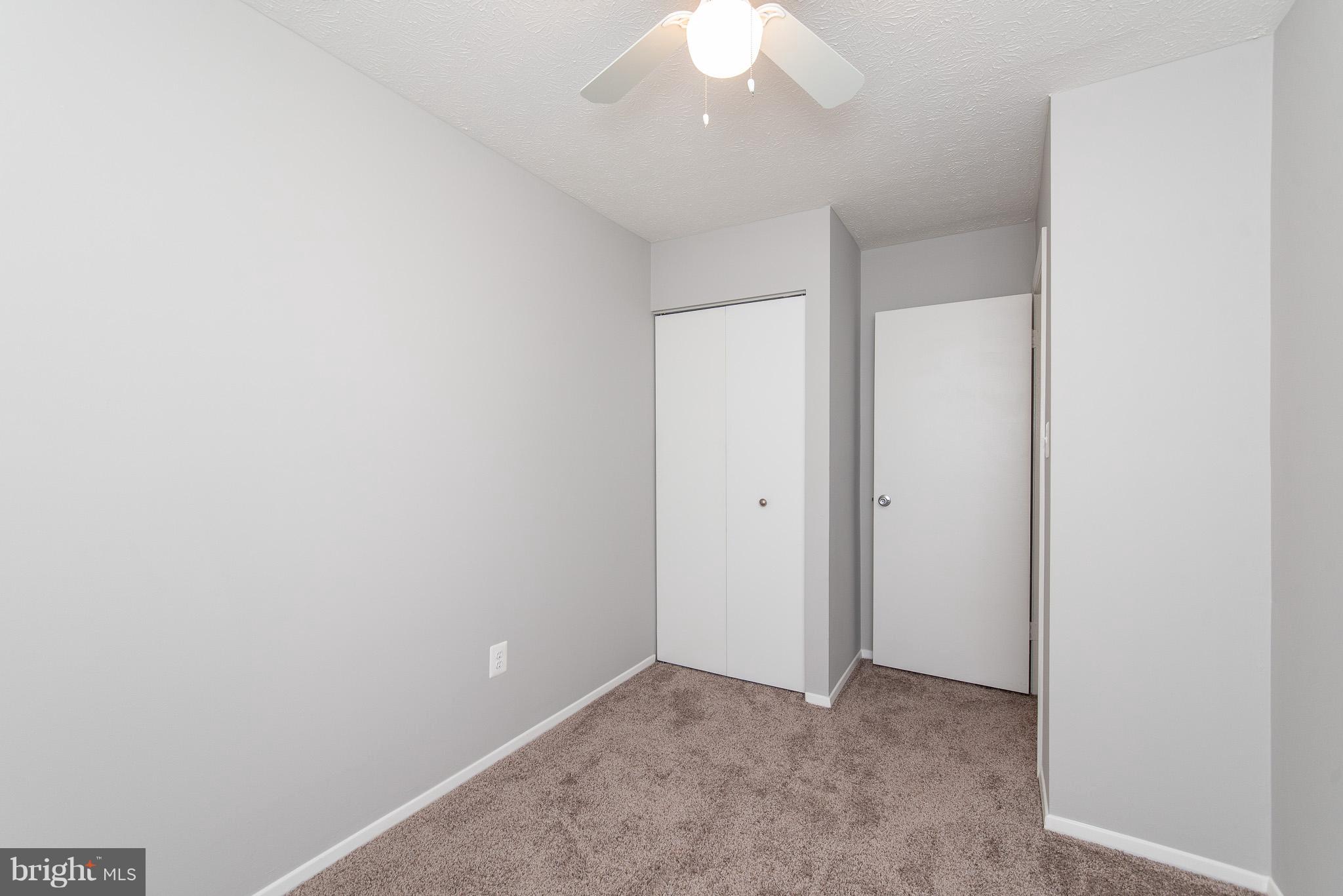 426 Kosoak Road Baltimore, MD 21220 - Photo 19 of 30 an empty room with a chandelier fan