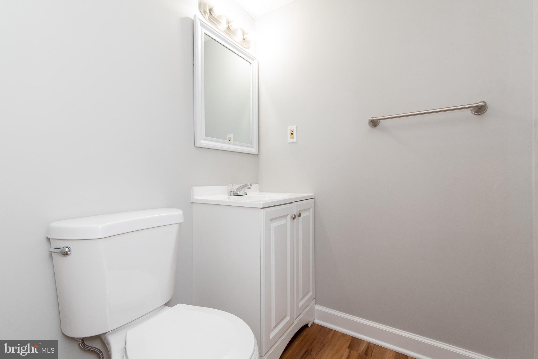 426 Kosoak Road Baltimore, MD 21220 - Photo 24 of 30 a white toilet sitting next to a white sink