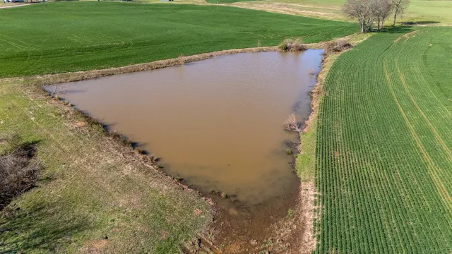 a view of a green field with clear sky
