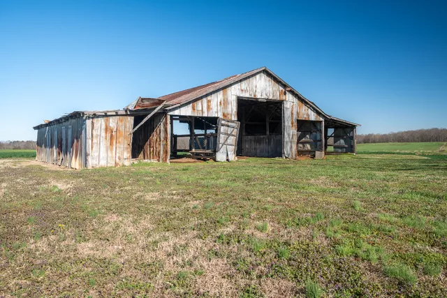 an aerial view of a house with outdoor space