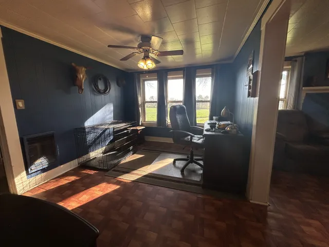a room with wooden floor and furniture