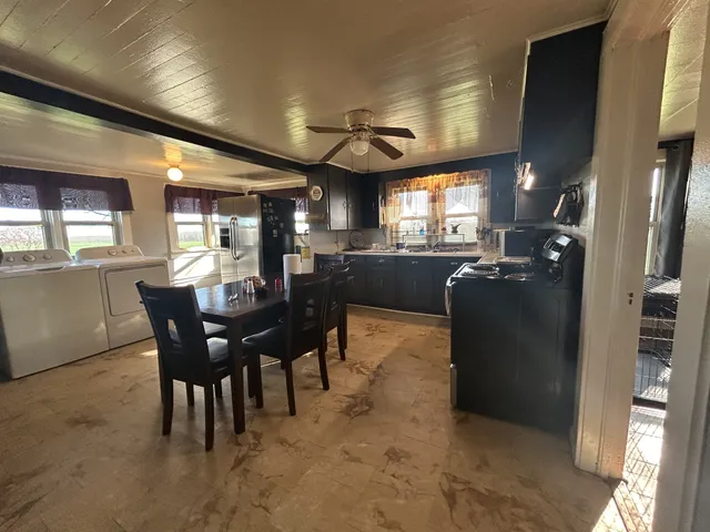 a bathroom with a sink toilet and a mirror