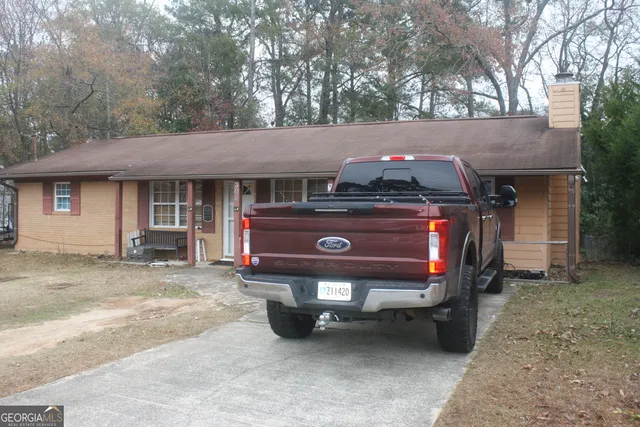 a view of house with outdoor space