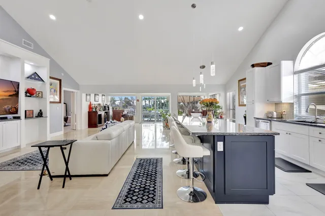 a view of a dining room with furniture and window