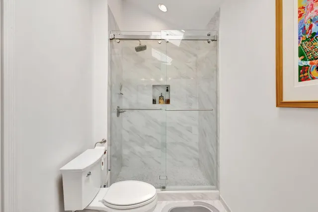 a kitchen with granite countertop a sink stove and cabinets