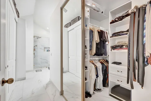 an aerial view of a house with a swimming pool