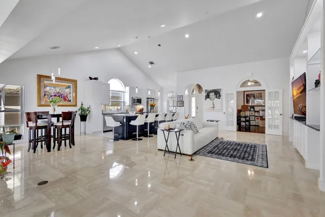 a living room with lots of furniture and a flat screen tv