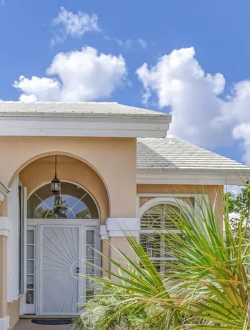 a view of a livingroom with wooden floor and a piano