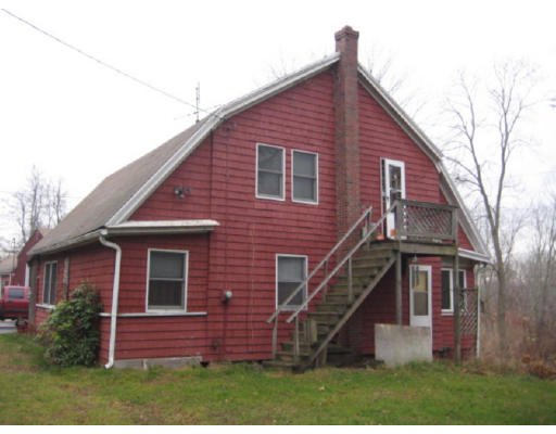 492 Easthampton Road Northampton, MA 01060 - Photo 1 of 3 a view of a brick house with a yard
