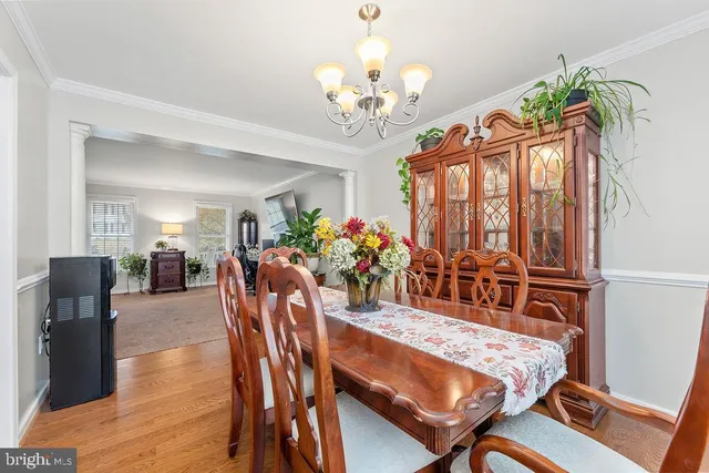 a kitchen with stainless steel appliances kitchen island granite countertop a sink dishwasher stove and cabinets