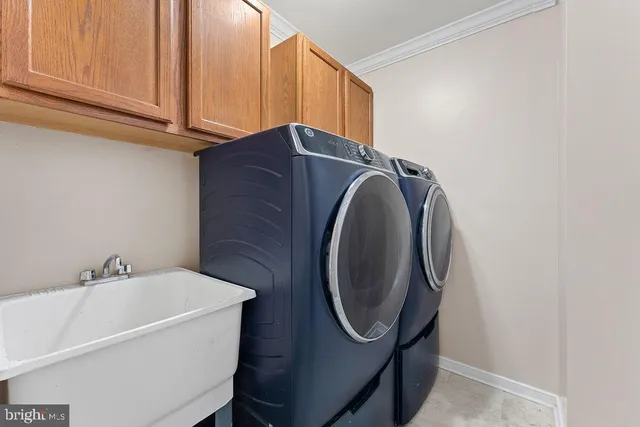 a kitchen with granite countertop a stove top oven a sink dishwasher and a refrigerator