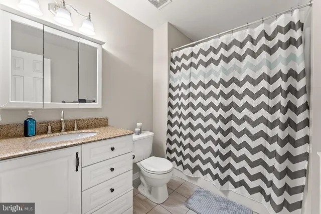 a bedroom with furniture and a table