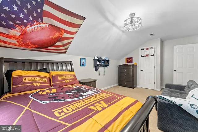 a room with a bed and a baby crib