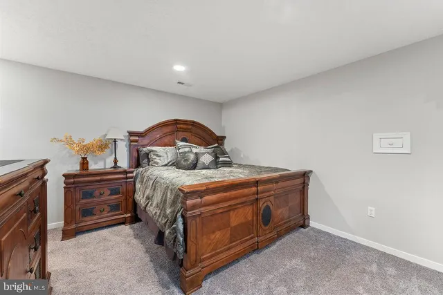 a kitchen that has a sink and a stove with white walls