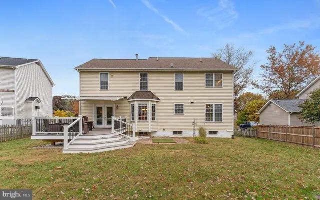 a house with trees in the background