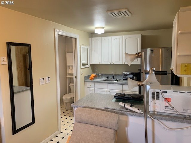 2840 Ferry Street Eugene, OR 97405 - Photo 35 of 35 a kitchen with stainless steel appliances granite countertop a refrigerator a stove and a sink