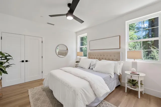 a bedroom with a bed and a window