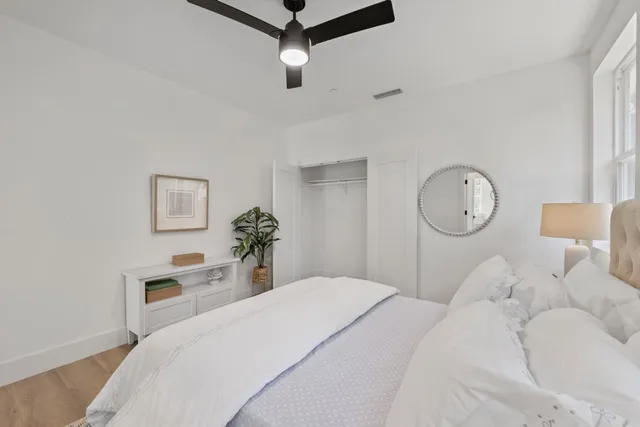 a bedroom with bed and a window